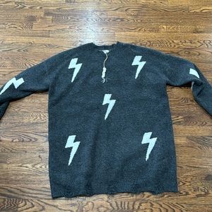 Charcoal sweater with lightening bolt brand Easel